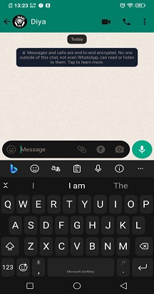 Microsoft SwiftKey keyboard open in a WhatsApp conversation
